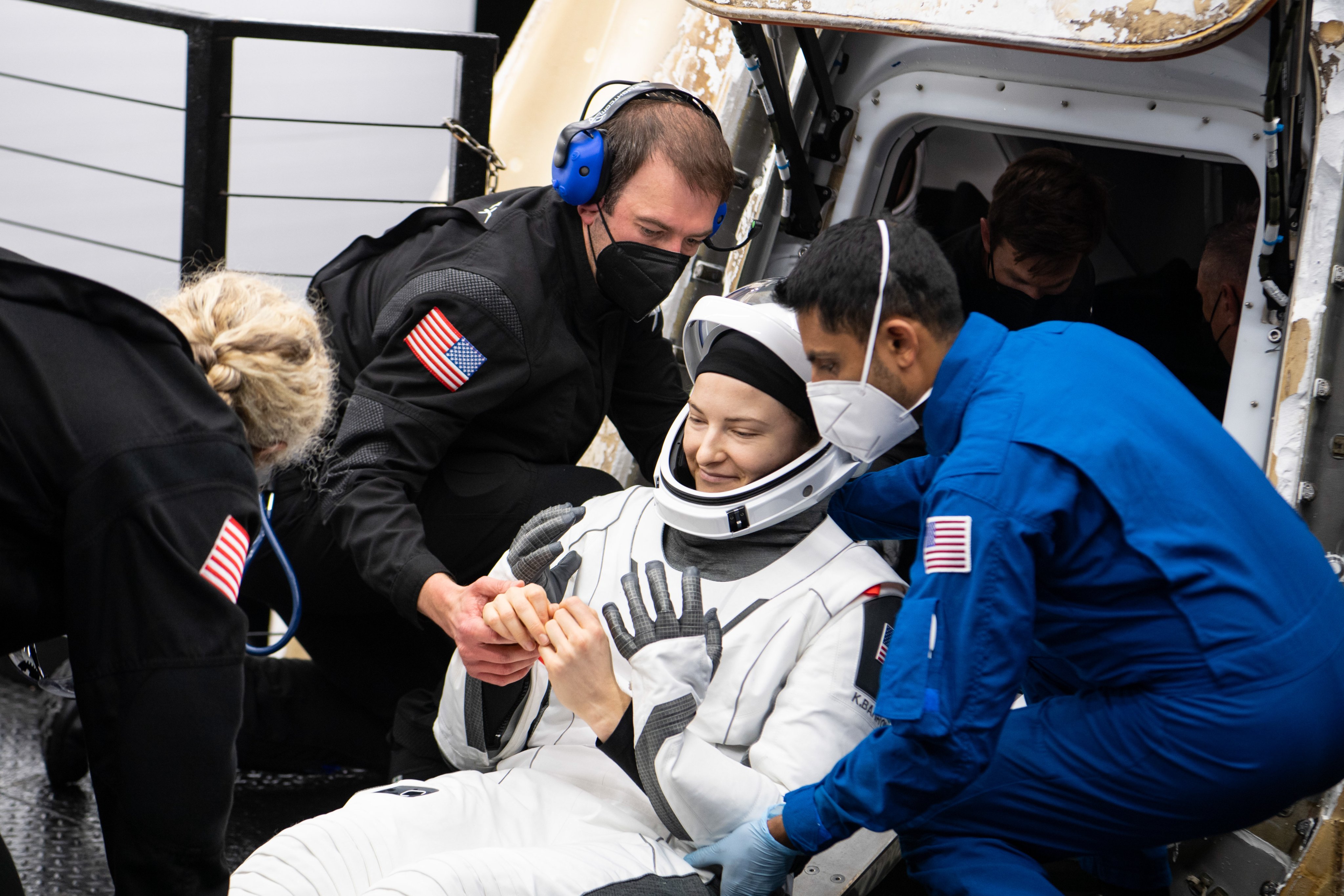 NASA astronaut Kayla Barron is helped out of the SpaceX Crew Dragon Endurance spacecraft onboard the SpaceX Shannon recovery ship.