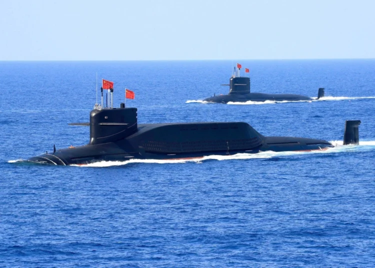 A nuclear-powered Type 094A Jin-class ballistic missile submarine of the Chinese People's Liberation Army Navy in waters during a military display in the South China Sea in April 2018. | REUTERS